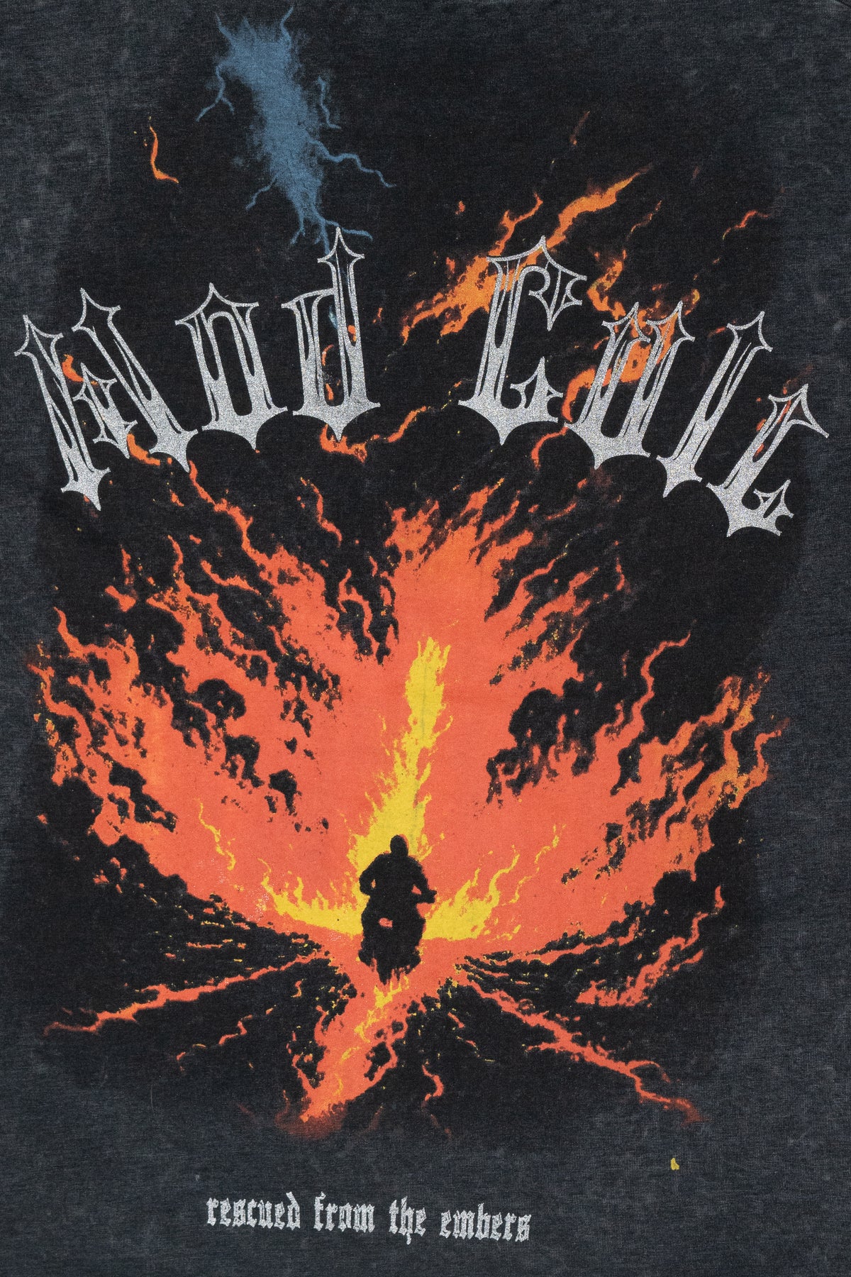 Mad Evil Rescued from the embers graphic tee print with a biker silhouette riding toward bright flames