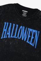 Black mineral wash t-shirt with blue arched Halloween graphic text across the chest