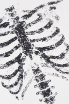 Distressed black skeleton ribcage graphic printed on white fabric