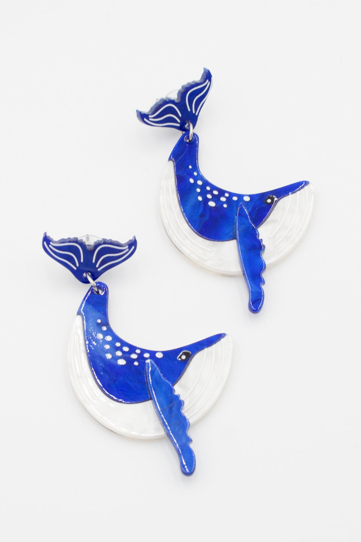 Blue and white acrylic humpback whale drop earrings