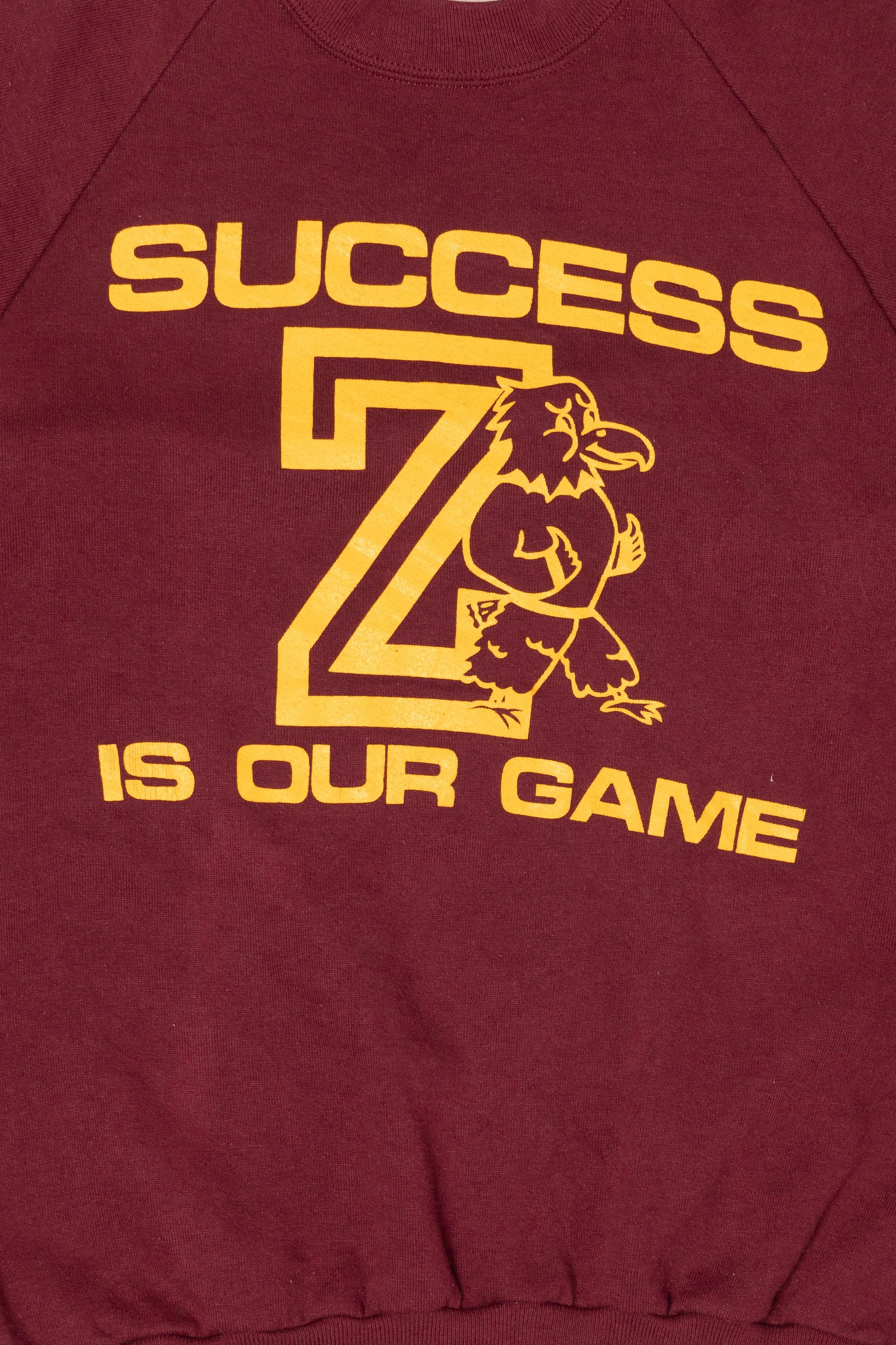 Vintage Burgundy "Success Is Our Game" Raglan Sweatshirt (1990s)