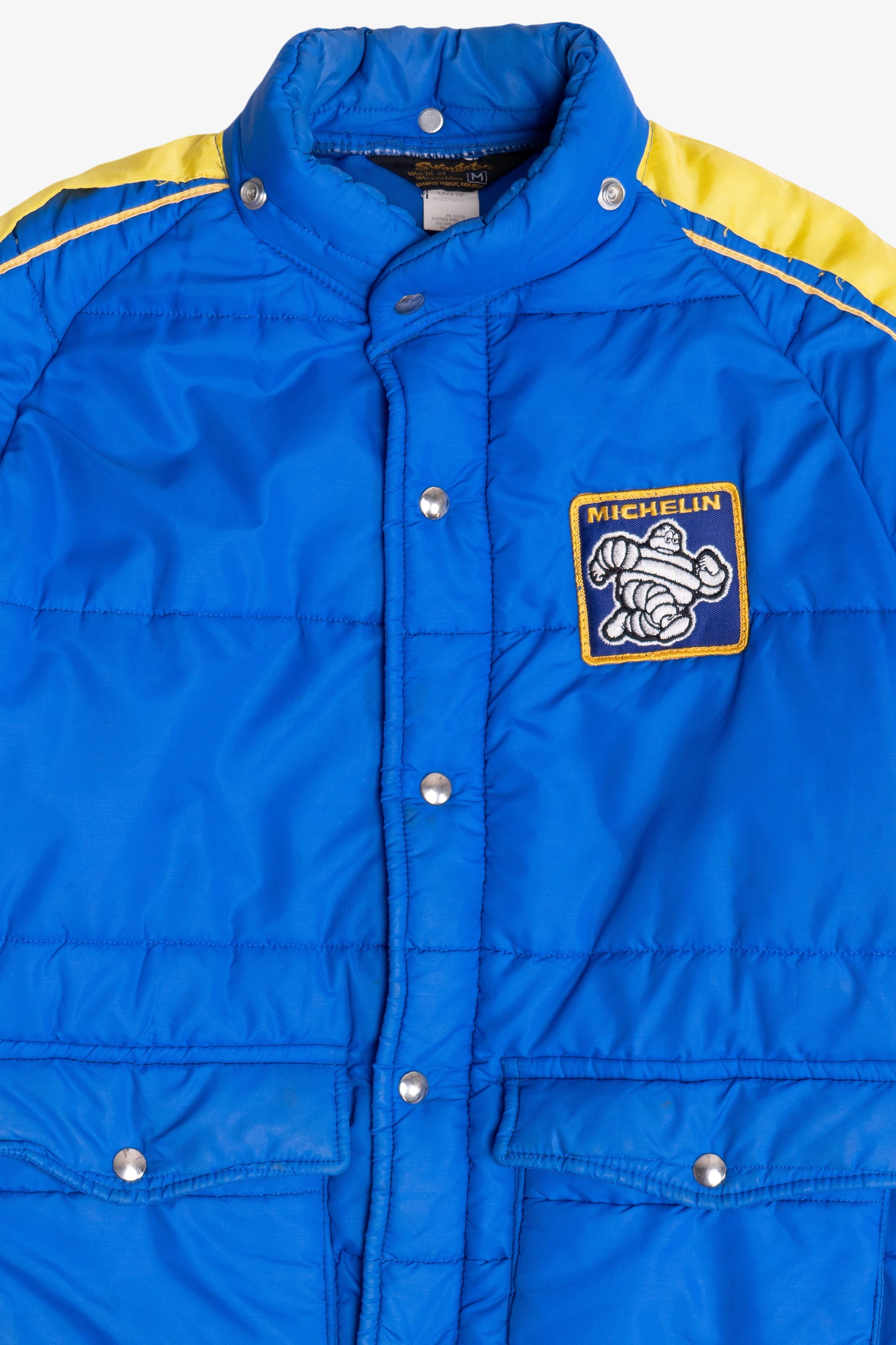 Vintage Swingster Michelin Man Patch Sleeve Spellout Puffer Jacket (1980s)