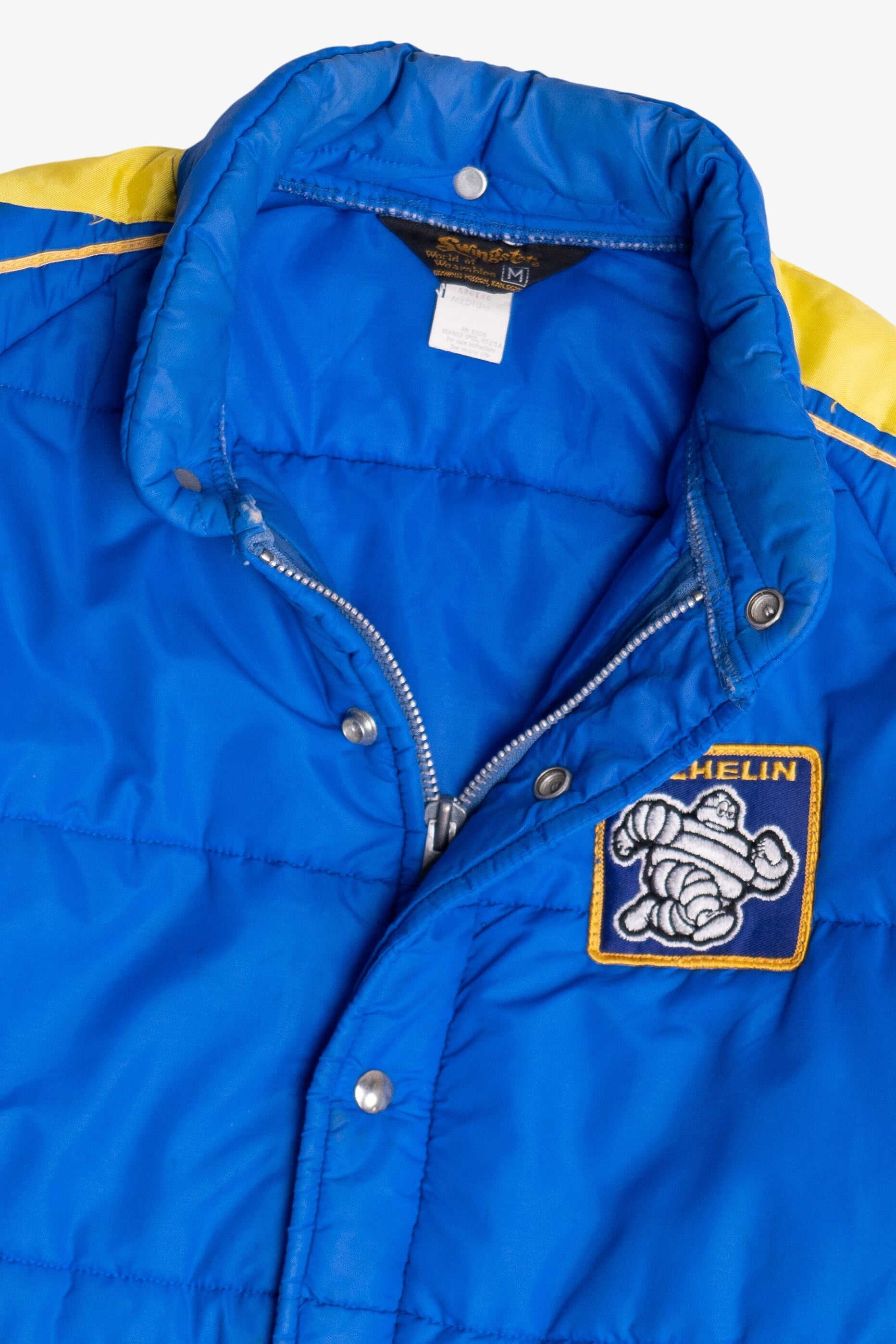 Vintage Swingster Michelin Man Patch Sleeve Spellout Puffer Jacket (1980s)