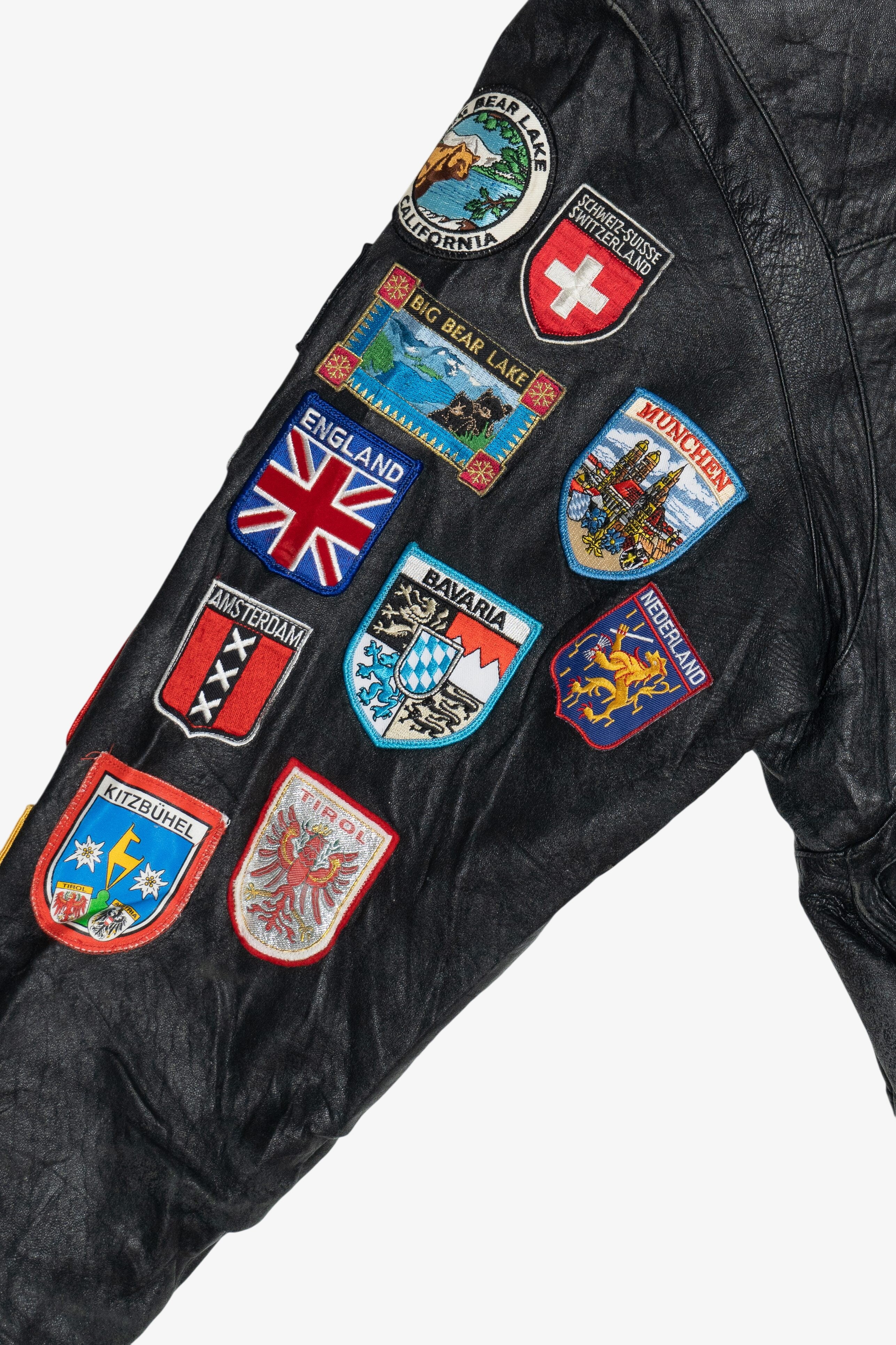 Vintage Distressed Gold's Gym Embroidered Leather Jacket With Car & Travel Patches (1990s)