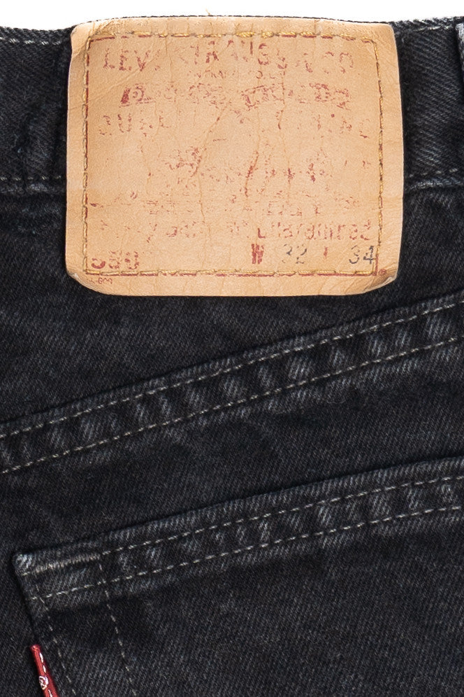 Vintage Distressed Levi's 550 Black Denim Cut Off Shorts (1990s)