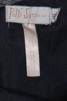 Polli Says brand label sewn inside the Pinstripe Adjustable Ties Balloon Skirt on black fabric background