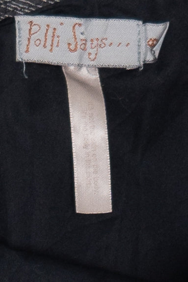 Polli Says brand label sewn inside the Pinstripe Adjustable Ties Balloon Skirt on black fabric background