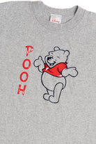 Vintage "Pooh" Spellout Plastic Lined Character Disney Store T-Shirt (2000s)