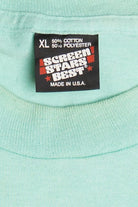 Vintage "Life Is Uncertain So Eat Dessert First" Embossed Print T-Shirt (1990s)