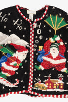 Vintage Black Studio Works Santa Skiing Parachuting Ugly Christmas Cardigan (1990s)
