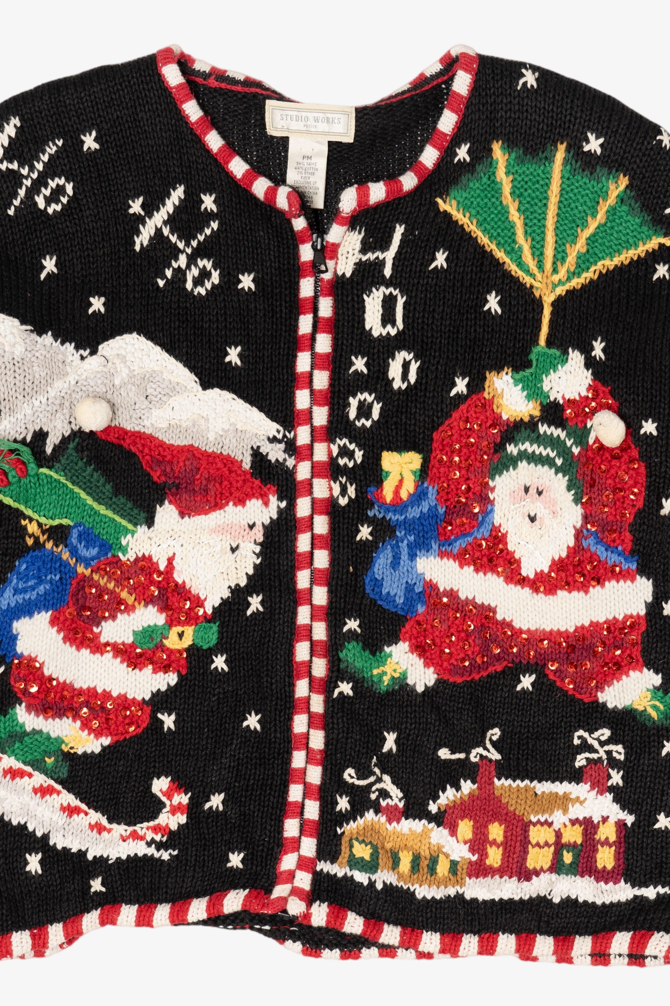 Vintage Black Studio Works Santa Skiing Parachuting Ugly Christmas Cardigan (1990s)