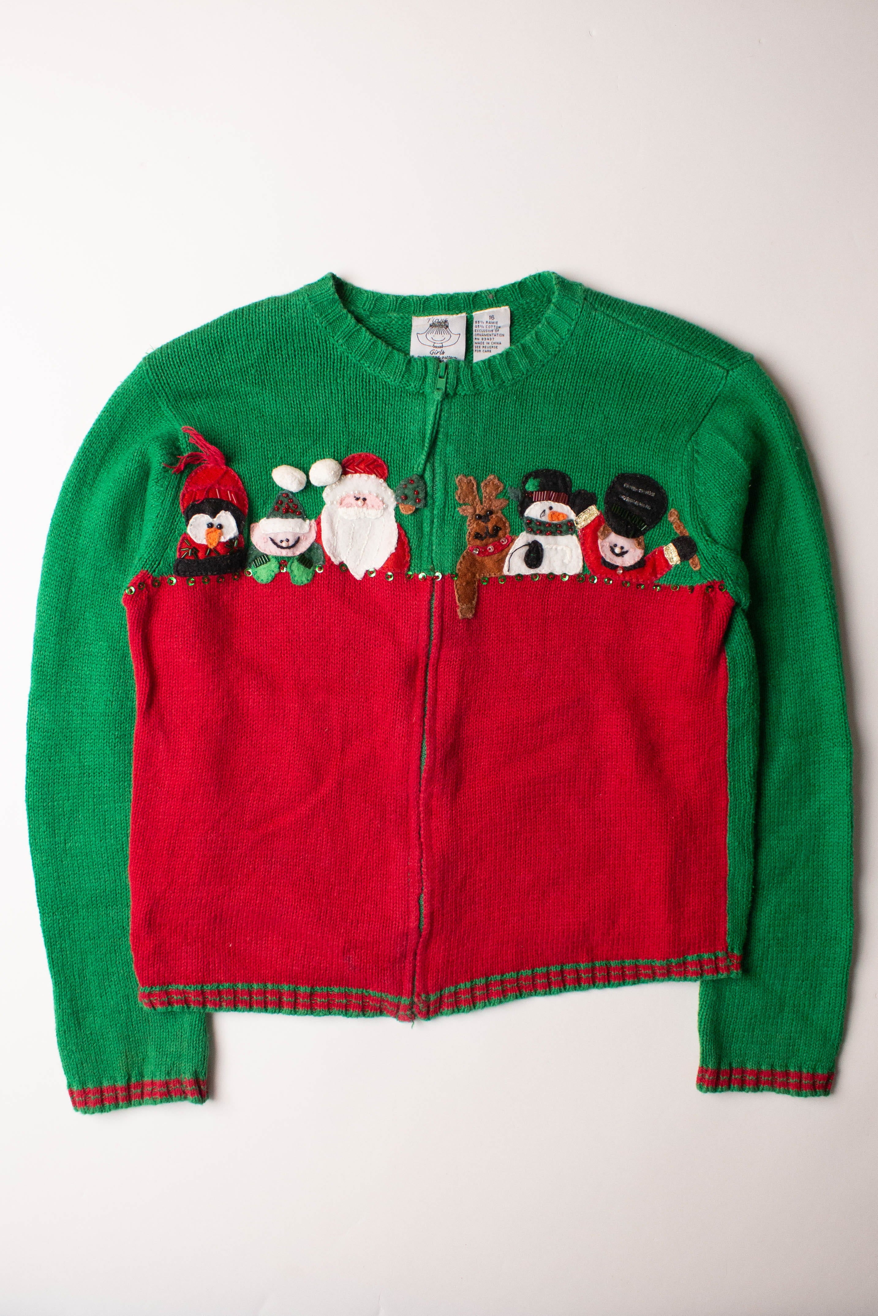 Kids green and red ugly Christmas cardigan with festive holiday characters and zipper front closure