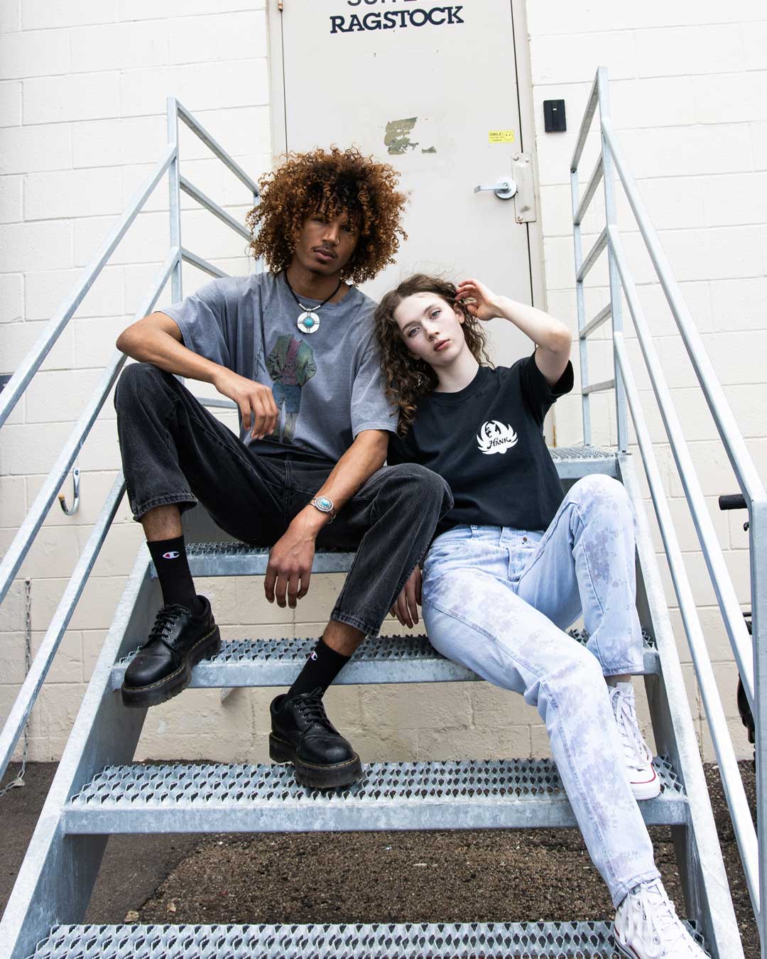 2 models wearing vintage tees and vintage denim