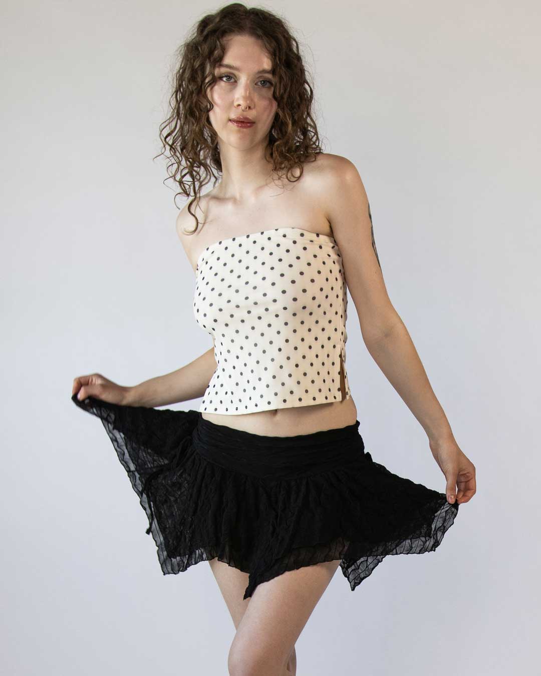 Female model wearing our top selling skirt and polka dot tube top